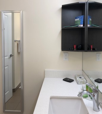 Park Inn YYC Calgary Washroom Shelves Cosmetics Tidy